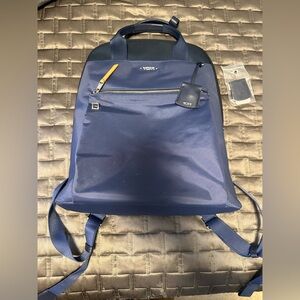 Gently used TUMI backpack. Gorgeous rare color! Inside is in pristine condition